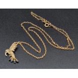 A 9K Yellow Gold and Sapphire Bird of Prey Pendant - On a 9K yellow gold link necklace. 2.5 and