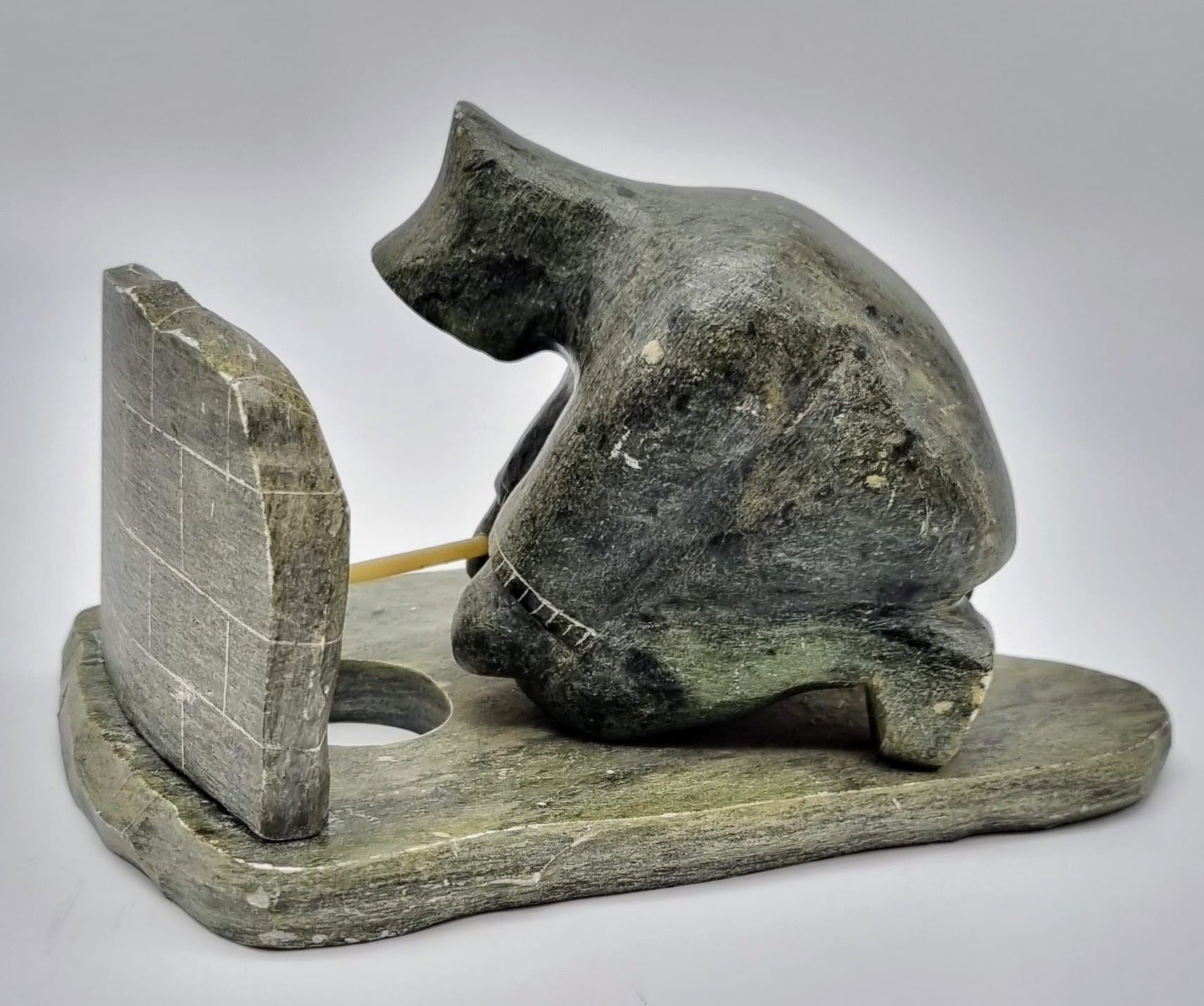 An Antique Newfoundland and Labrador Inuit Soapstone Hand-Carved Figure of an Ice Fisherman. - Image 2 of 6