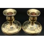 A Pair of Antique Sterling Silver Candle Sticks. 8cm tall. Weighted. 461g total weight.