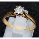 A 9K Yellow Gold Diamond Ring. Four small diamonds. Size O. 2.16g total weight.