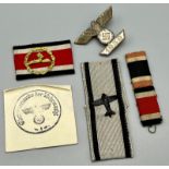 A collection of replica Third Reich Ribbons and Badges