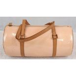 A Louis Vuitton White Monogrammed Vernis Bedford Handbag. Gold tone and leather straps. Pink leather