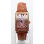 A FRANCK MULLER LONG ISLAND LADIES WATCH IN 18K GOLD WITH DIAMOND BEZEL. 23 X 32mm (9107)