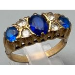 A 9K Yellow Gold Blue and White Stone Ring. Size O. 4.1g total weight.
