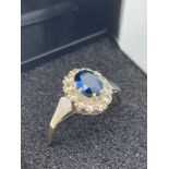 9 carat GOLD, TANZANITE and WHITE TOPAZ RING,Having oval cut Tanzanite set to top with White Topaz