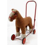 A 1950'S CHILDS HORSE EARLY WALKING TROLLEY TOY. A/F