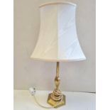 Stylish looking table lamp, Gold colouring to base with cream shade. Stands 60cm in height. Full