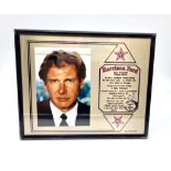 A Harrison Ford Picture (1990s) and Informative Plaque. In frame - 25 x 21cm.