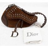 A Christian Dior Suede Studded Saddle Bag. Decorated with studs and crystals - the suede body has