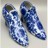 A Pair of Vintage Blue and White Porcelain Shoes. 18 x 10cm. In good condition but A/F.