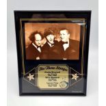 A Three Stooges Picture with Name and Date Plaque. In frame - 20 x 26cm.