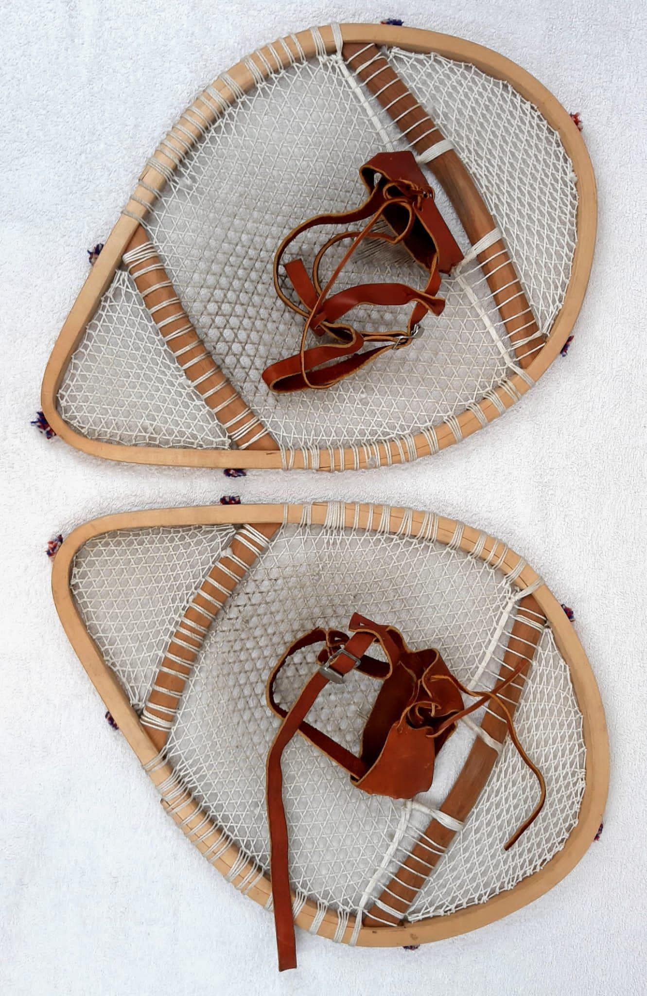 A Pair of Vintage Hand-Crafted Innuit Snowshoes from Newfoundland and Labrador. 58 x 40cm.