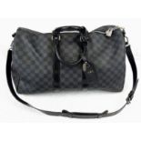A Louis Vuitton Keepall 45 Bandouliere. Crafted in luxurious darnier graphite checked canvas. In
