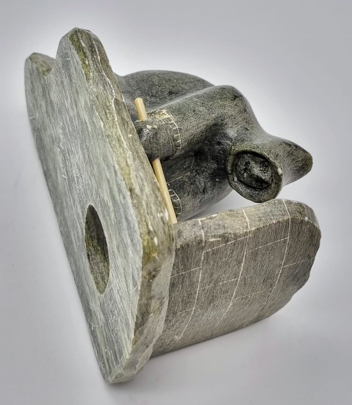 An Antique Newfoundland and Labrador Inuit Soapstone Hand-Carved Figure of an Ice Fisherman. - Image 4 of 6