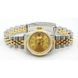 A LADIES BI-METAL ROLEX OYSTER PERPETUAL DATEJUST WITH GOLDTONE DIAL IN ORIGINAL BOX WITH PAPERS.