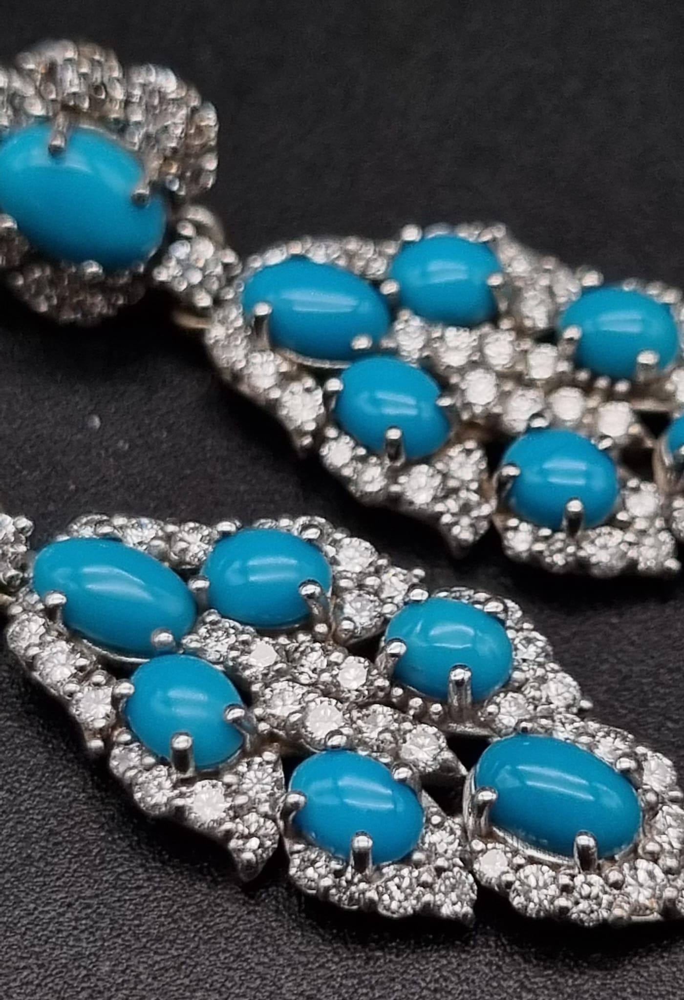 A Pair of Vintage 18K White Gold Diamond and Turquoise Earrings. A turquoise cabochon surrounded - Image 3 of 3