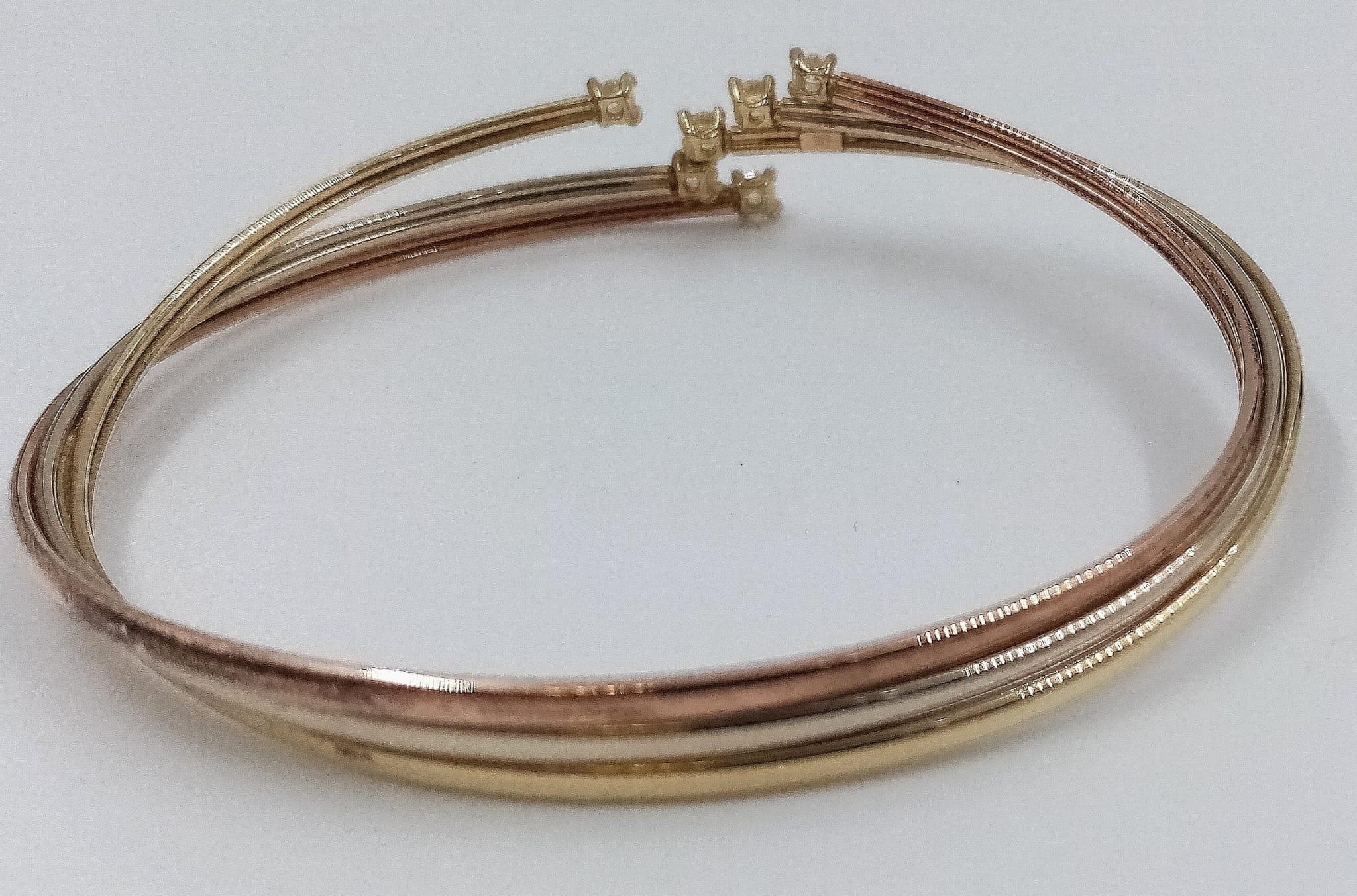 A 9K Yellow, Rose and White Gold White-Stone Twisted Bangle. 6.1g total weight. - Image 3 of 4