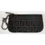 A Fendi Monogrammed Brown Key Chain Pouch. Canvas and leather with a Fendi key chain attached. In