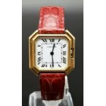 A CARTIER OCTAGONAL TANK STYLE WATCH IN 18K GOLD WITH PINK LEATHER STRAP AND MANUAL MOVEMENT. 28 X