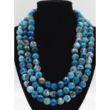 A 1200ct Shades of Blue Dragons Vein Three-Row Agate Bead Necklace. 40-44cm. 12mm beads.