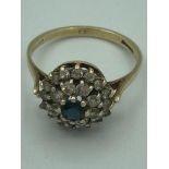 9 carat GOLD, SAPPHIRE and WHITE QUARTZ CLUSTER RING. 2.64 grams Size O.