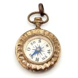 Victorian yellow metal pendant compass with original loop. 3.3cm x 2.3cm. Weight: 3.7 grams.