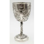 An Antique 19th Century Large Solid Silver Goblet. Ornate floral decoration throughout. 19.5cm tall.