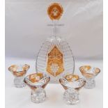 Vintage amber colour decanter with 5 glass shots. In very good condition.