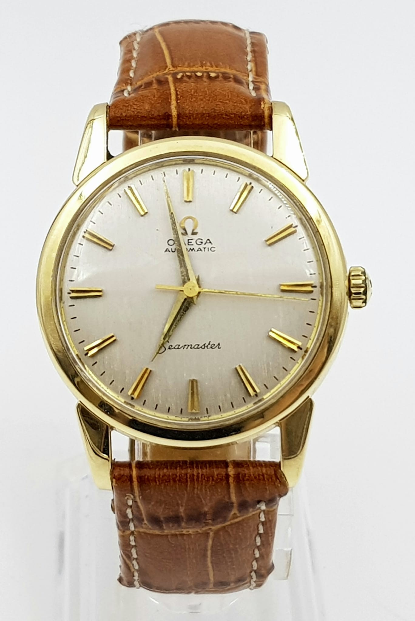 A VINTAGE 9K GOLD OMEGA SEAMASTER AUTOMATIC WATCH WITH LEATHER STRAP , RECENTLY SERVICED. 34MM