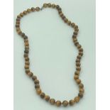 TIGERS EYE BEAD NECKLACE having 64 polished stones with individual knotting to each piece. 925