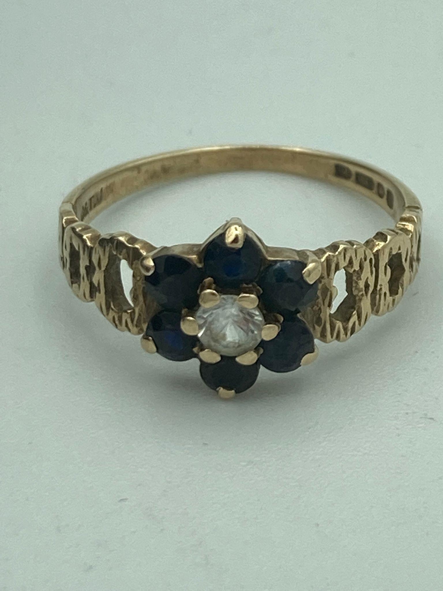 9 carat GOLD RING with SAPPHIRE CLUSTER and WHITE TOPAZ centre stone. Attractive gold open work