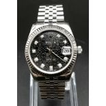 A 32mm ROLEX DATEJUST IN STAINLESS STEEL WITH BLACK DIAL AND COMPLIMENTARY DIAMOND NUMERALS AND