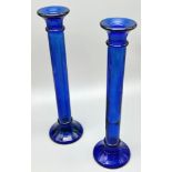A Pair of Cobalt Blue Glass Candlesticks. 28cm tall. In good condition but A/F.