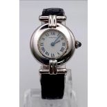 A CARTIER LADIES WATCH IN SILVER WITH ORIGINAL CARTIER STRAP, ROMAN NUMERALS AND SAPPHIRE CROWN.