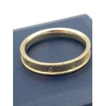 9 carat GOLD BAND having three diamond points set to top. Full UK hallmark. Complete with ring