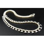 A SEED PEARL AND TRIANGULAR DIAMOND NECKLACE SET IN 14K WHITE GOLD. 11.2gms 48cms