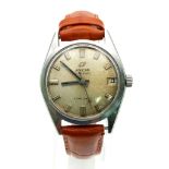 A Vintage Enicar Automatic Watch. Brown leather strap. Stainless steel case - 32mm. Date window.