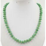 An Emerald Beaded Necklace. Gilded spacers and clasp. 44cm.