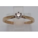 A 9K White and Yellow Gold Diamond Solitaire Ring. Diamond places in a Crown setting. Size N/M.