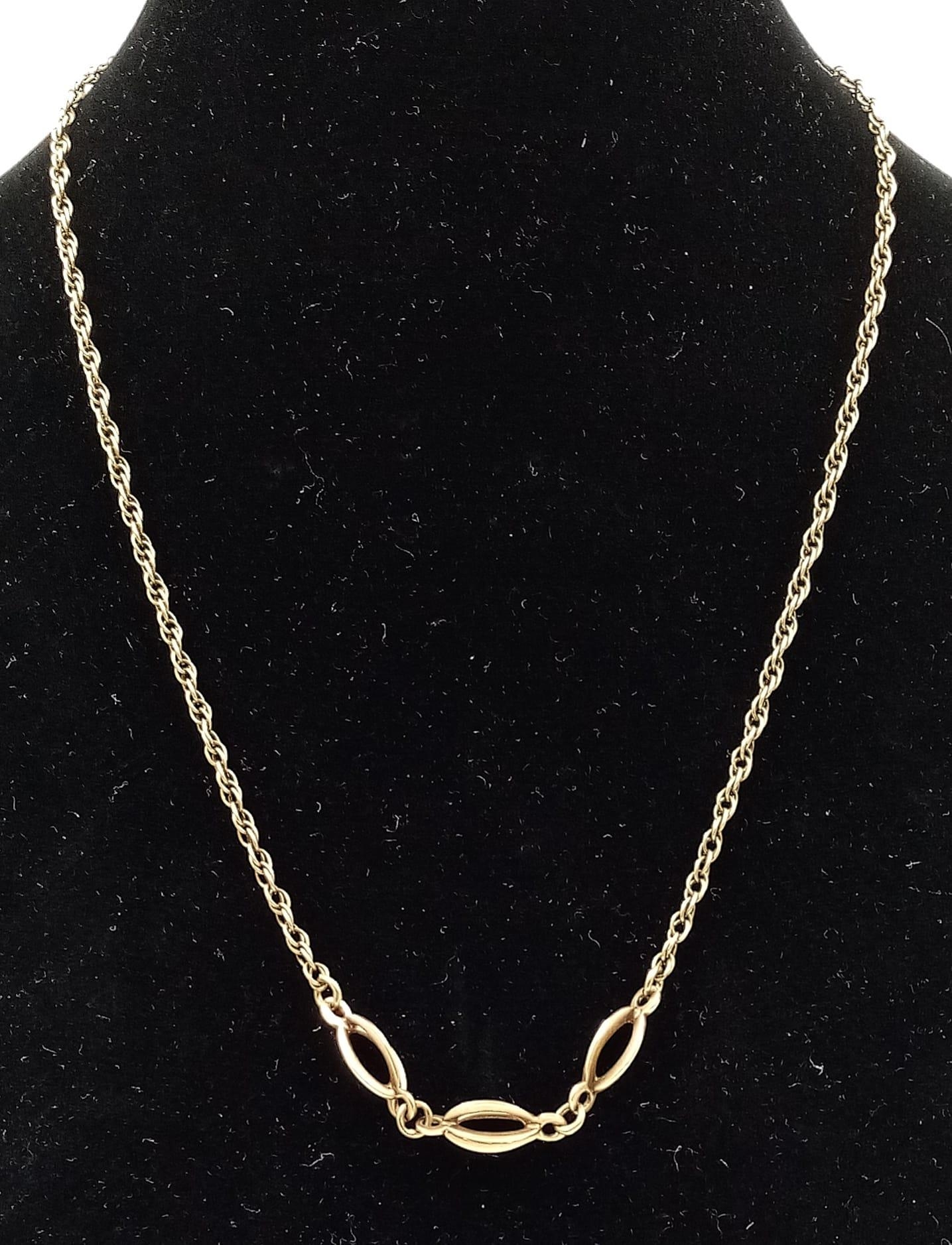A Vintage 9K Yellow Gold Prince of Wales Link Necklace with Treble-Crossover-Oval Drop Pendant.
