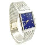 A PIAGET 18K WHITE GOLD WATCH WITH A BEAUTIFUL BLUE SQUARE FACE MANUAL MOVEMENT. 28 X 23MM