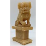 An Early Chinese Soapstone Foo Dog Figure. 21 x 11cm.