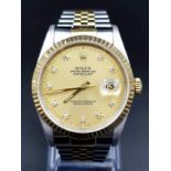 A ROLEX BI-METAL OYSTER PERPETUAL DATEJUST WITH DIAMOND NUMERALSAND GOLDTONE DIAL. 36mm