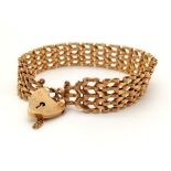 A 9K Yellow Gold Ladder-Link Bracelet with Heart Clasp. 16cm plus 6.5cm chain. 18.66g.