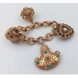 An 18K Yellow Gold Asian Inspired Bracelet - 12ct of multi-coloured gemstones over four outrageous