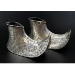 Chinese unmarked solid silver tested pair of shoes. It is decorated and carved with birds and