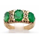 A 9K Yellow Gold Emerald and Diamond Ring. Three oval emeralds separated by diamonds. Size O. 5.