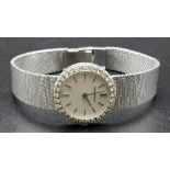 A JAEGER LE COULTRE 18K WHITE GOLD LADIES DRESS WATCH WITH DIAMOND BEZEL AND SOLID GOLD STRAP. 22mm.