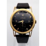 A VINTAGE LE COULTRE 18K GOLD SLIMLINE WATCH WITH MANUAL MOVEMENT , BLACK DIAL AND SECOND DISLAY
