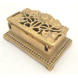 Antique Victorian brass stamp box decorated with flowers on the lid with two part. 10cm x 6cm.